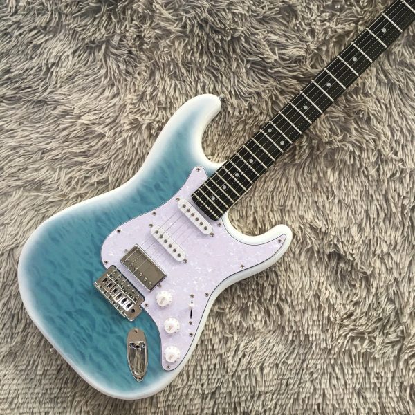 6 string st electric guitar light blue solid basswood body, maple neck, ssh pickups, rosewood fretboard, quilted maple top, chrome hardware, 22 frets, single tremolo bridge, fully enclosed design