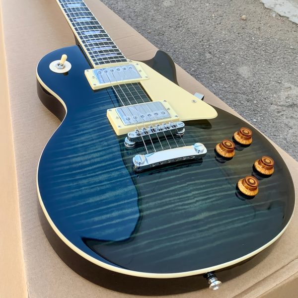 electric guitar with carbon tassel detail black & teal hybrid design, 22 frets, f hole details, & rosewood neckboard room electrical hardwired, 36v or below, electric guitar